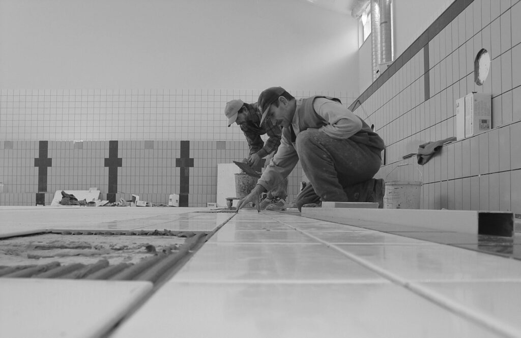 pexels photo 24357101 24357101 Professional workers tiling a bathroom interior, showcasing expertise in construction.